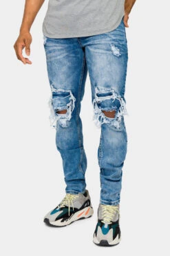 Destroyed And Distressed Denim Jeans
